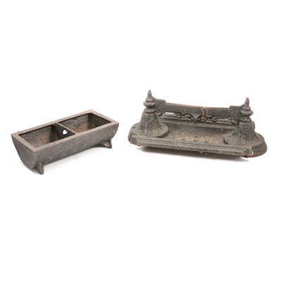 Lot 174 - Victorian cast iron boot scraper and a small iron hen feeding trough