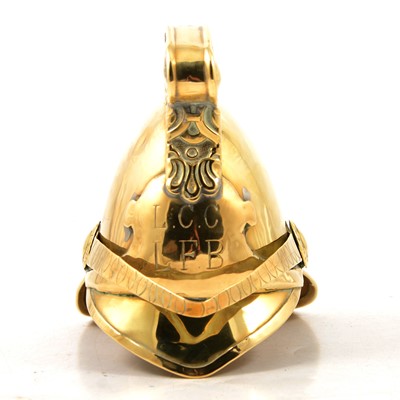 Lot 122 - Novelty brass money box in the form of a fireman's helmet