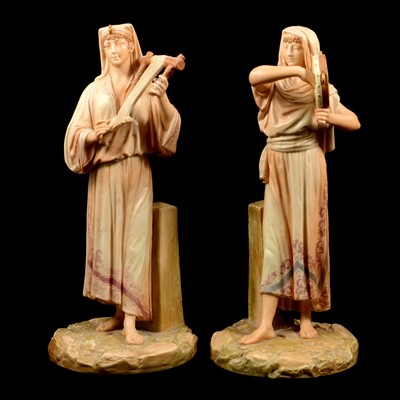 Lot 38 - A matched pair of late 19th Century Royal Worcester Hadley figurines of musicians.
