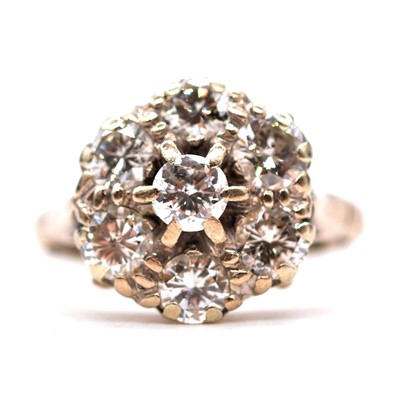 Lot 24 - A diamond cluster ring.