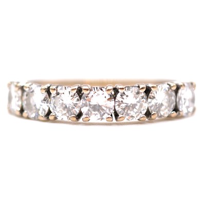 Lot 34 - A diamond eternity ring.