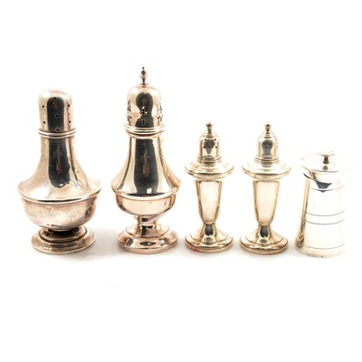 Lot 243 - A silver urn shape pepper mill, two casters and pair of weighted peppers.