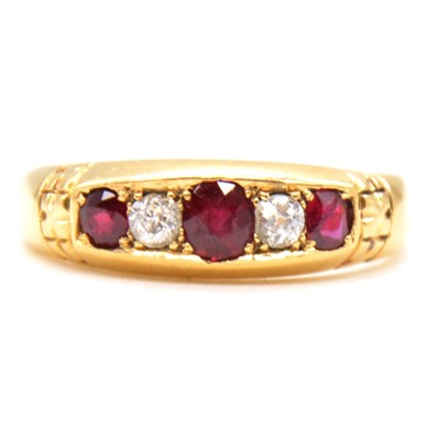 Lot 49 - A ruby and diamond half hoop ring.