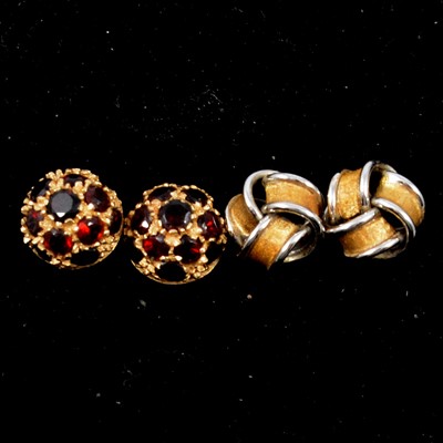 Lot 153 - Two pairs of earrings for pierced ears, garnet clusters and 18 carat gold knots.