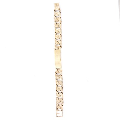 Lot 172 - A 9 carat yellow gold bark textured identity bracelet.