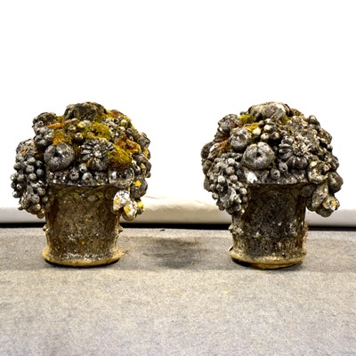 Lot 470 - Pair of reconstituted stone finials,  baskets of flowers