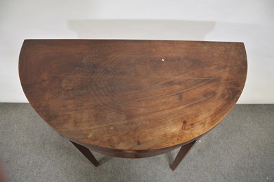 Lot 365 - Mahogany demi lune card table and a spinning wheel