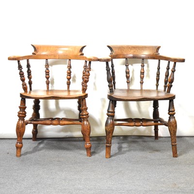 Lot 335 - Two Victorian elm and beech elbow chairs, branded