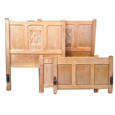 Lot 315 - Pair of limed oak single beds and a triple mirror