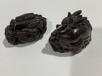Lot 141 - Collection of eleven carved wooden netsukes and a tagua nut netsuke