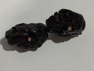 Lot 141 - Collection of eleven carved wooden netsukes and a tagua nut netsuke