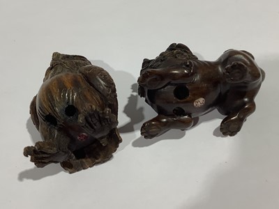 Lot 141 - Collection of eleven carved wooden netsukes and a tagua nut netsuke