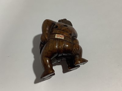 Lot 141 - Collection of eleven carved wooden netsukes and a tagua nut netsuke