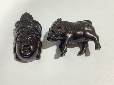 Lot 141 - Collection of eleven carved wooden netsukes and a tagua nut netsuke