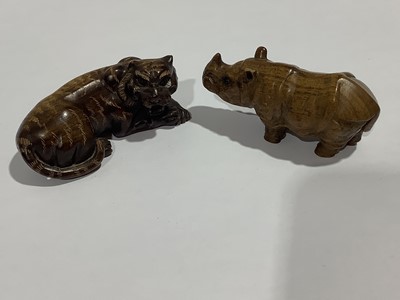 Lot 141 - Collection of eleven carved wooden netsukes and a tagua nut netsuke