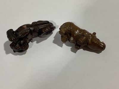 Lot 141 - Collection of eleven carved wooden netsukes and a tagua nut netsuke