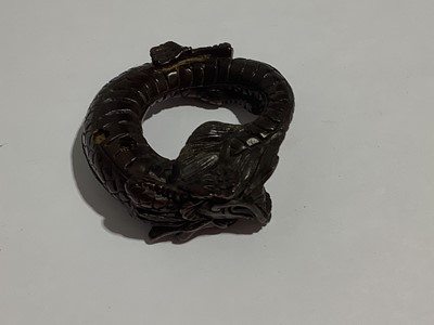 Lot 141 - Collection of eleven carved wooden netsukes and a tagua nut netsuke