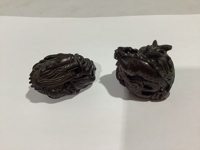 Lot 141 - Collection of eleven carved wooden netsukes and a tagua nut netsuke