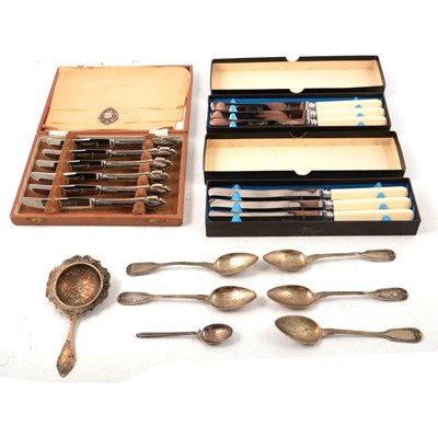 Lot 281 - A cased set of silver handled tea knives, 800 tea strainer and teaspoons, xylonite knives.