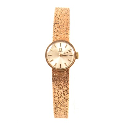 Lot 349 - Omega - a lady's 9 carat yellow gold bracelet watch.