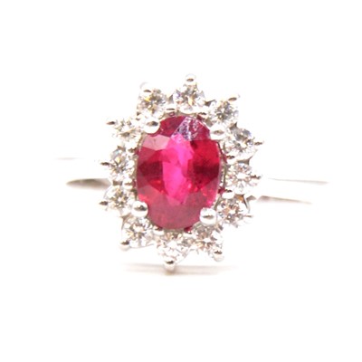 Lot 9 - A ruby and diamond cluster ring.