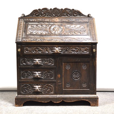 Lot 516 - Victorian carved oak bureau, the top with a...