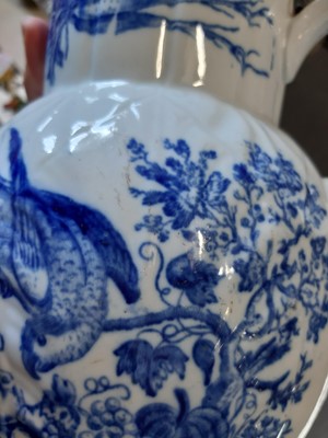 Lot 4 - Caughley blue and white cabbage-leaf mask jug, Parrot Pecking Fruit pattern