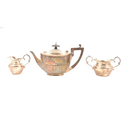 Lot 312 - A bachelor's silver teapot, together with another silver cream jug and sugar bowl