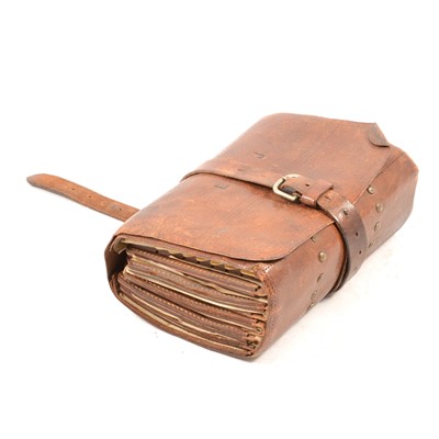 Lot 120 - A leather fly fishing book design wallet containing vintage flies.
