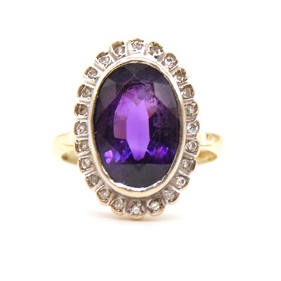Lot 75 - An amethyst and diamond cluster ring.