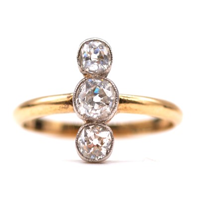 Lot 20 - A diamond three stone ring.