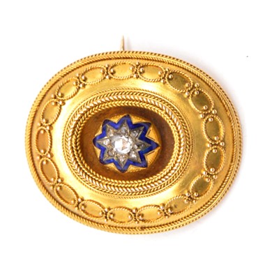 Lot 238 - A Victorian yellow metal Etruscan style target brooch with diamond set enamel star to centre.