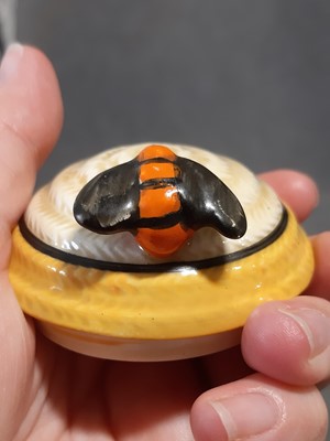 Lot 11 - A Clarice Cliff Bizarre preserve/honey pot and cover in the Gayday pattern.