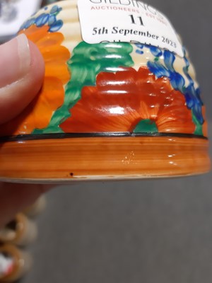 Lot 11 - A Clarice Cliff Bizarre preserve/honey pot and cover in the Gayday pattern.