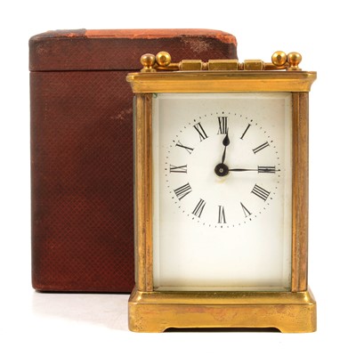 Lot 118 - Brass carriage clock and leather carrying case.
