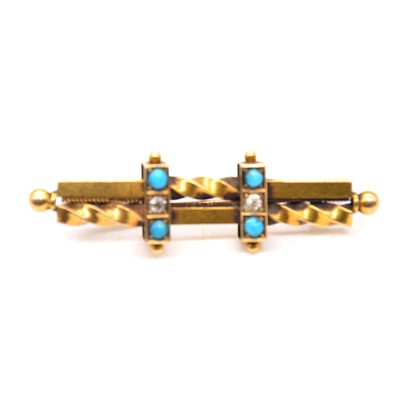 Lot 239 - A diamond, white paste and turquoise bar brooch.