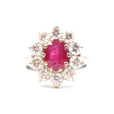 Lot 27 - A ruby and diamond cluster ring