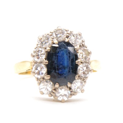 Lot 42 - A sapphire and diamond oval cluster ring