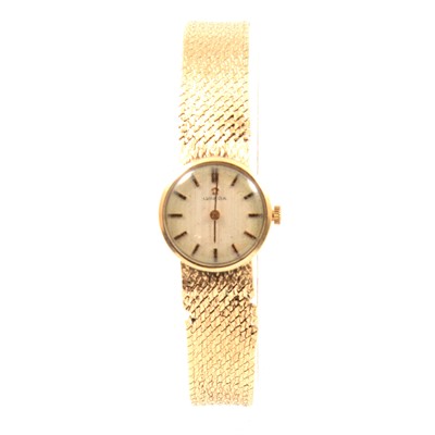 Lot 348 - Omega - a lady's 9 carat yellow gold bracelet watch.