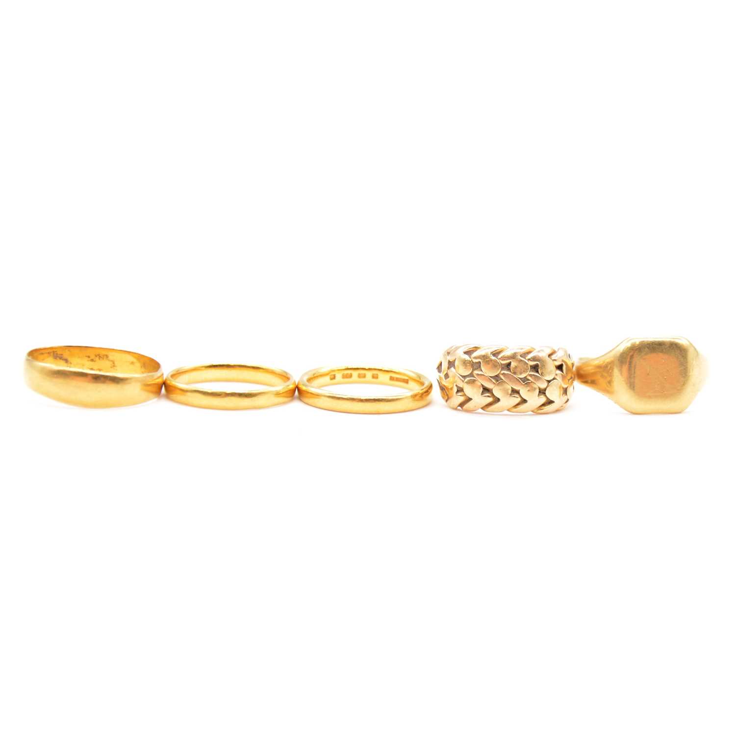 Lot 106 - Three gold wedding rings, signet ring and