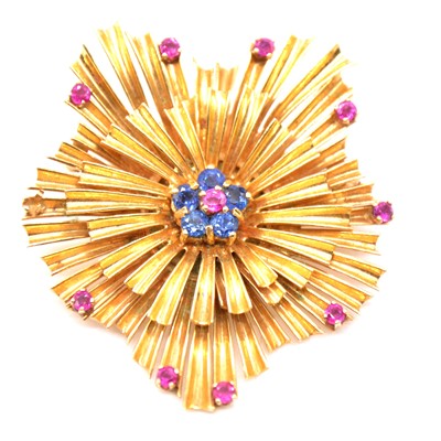 Lot 231 - A yellow metal starburst brooch.