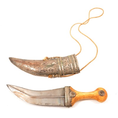 Lot 289 - An Eastern dagger with curved blade, horn handle and silver-plated scabbard.