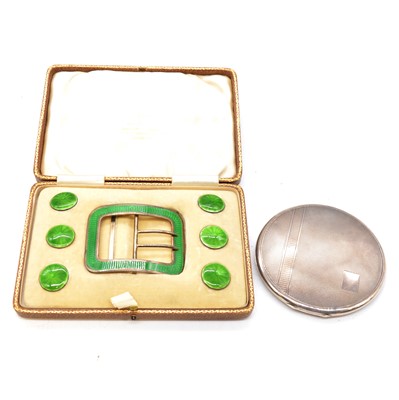 Lot 444 - A cased set of green guilloche enamel buttons and buckle, a silver compact.