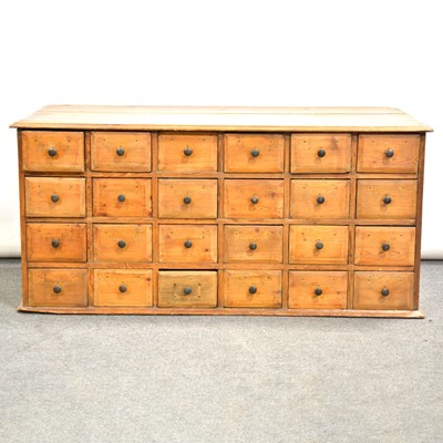 Lot 525 - Pine bank of twenty four drawers