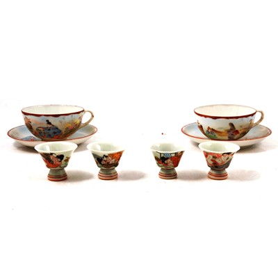 Lot 47 - Set of four Japanese erotic shinga sake cups and a pair of Kutani cups