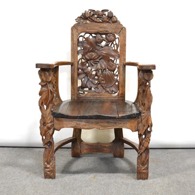 Lot 520 - An ornate carved wooden chair, Japanese style panels with Lotus flowers.