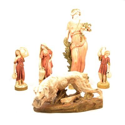 Lot 30 - Royal Dux - four figurines, water carriers,  and a Retriever