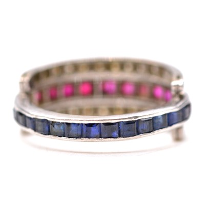 Lot 41 - A sapphire, ruby and diamond night and day ring.