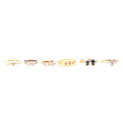 Lot 109 - Four gold rings and a pair of hoop earrings with synthetic white stones.