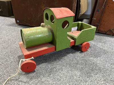 Lot 85 - Two vintage small suitcases, seven stained pine trays (possibly type trays), and a vintage pull-along train.